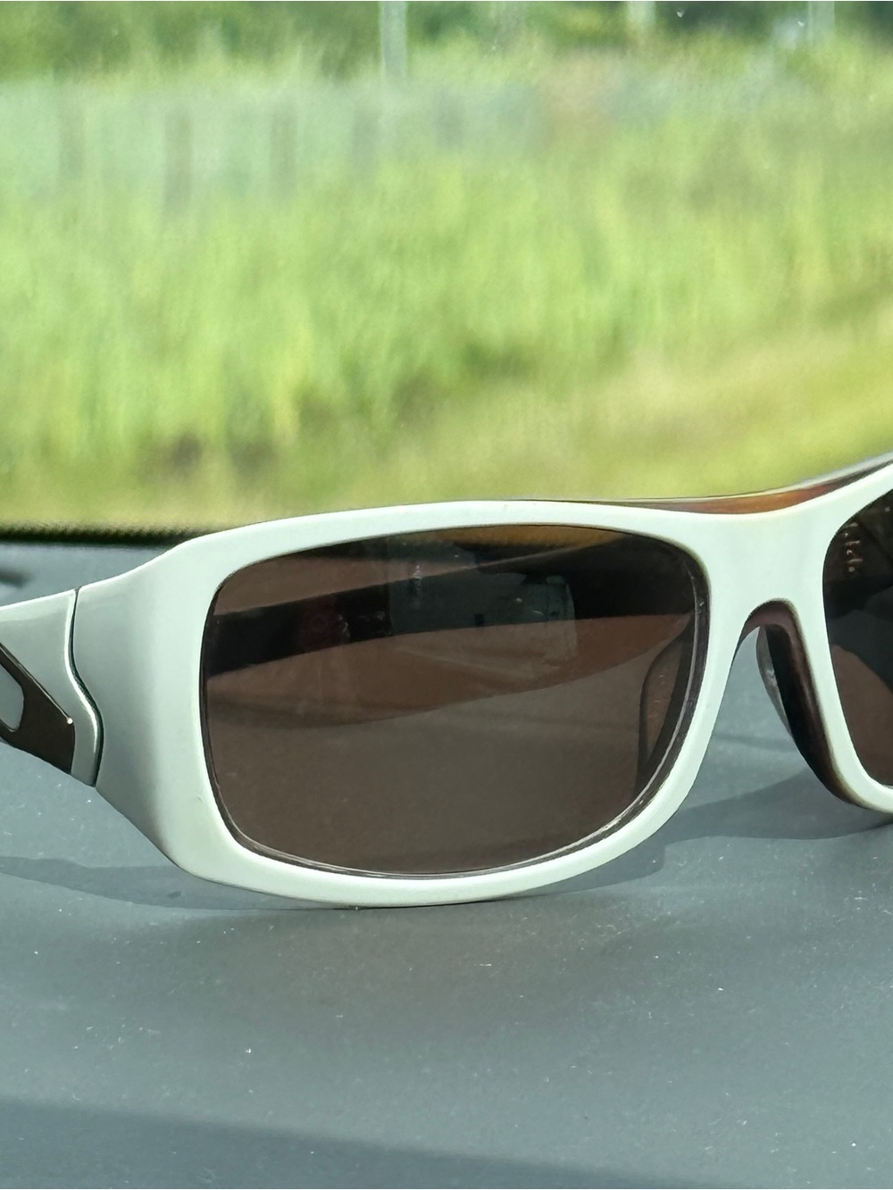 Oakley White Frame Sunglasses with Brown Lenses